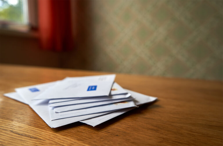 Stack of envelopes on the wooden table