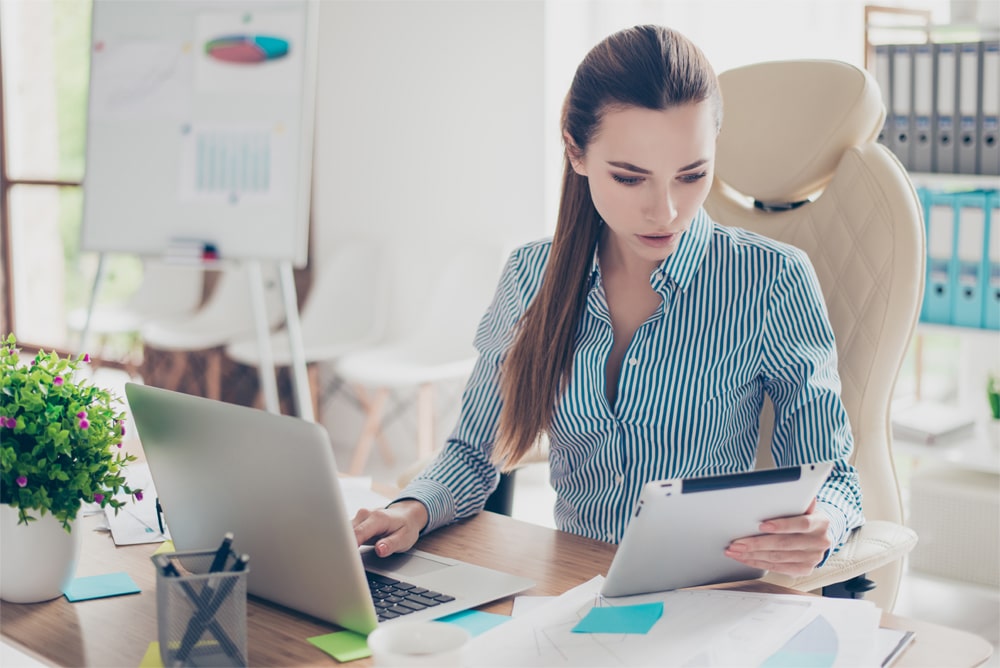 Portrait of serious young businesswoman accountant in formal wea