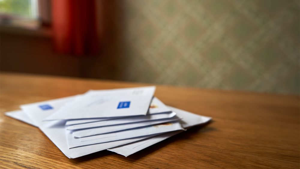 Stack of envelopes on the wooden table